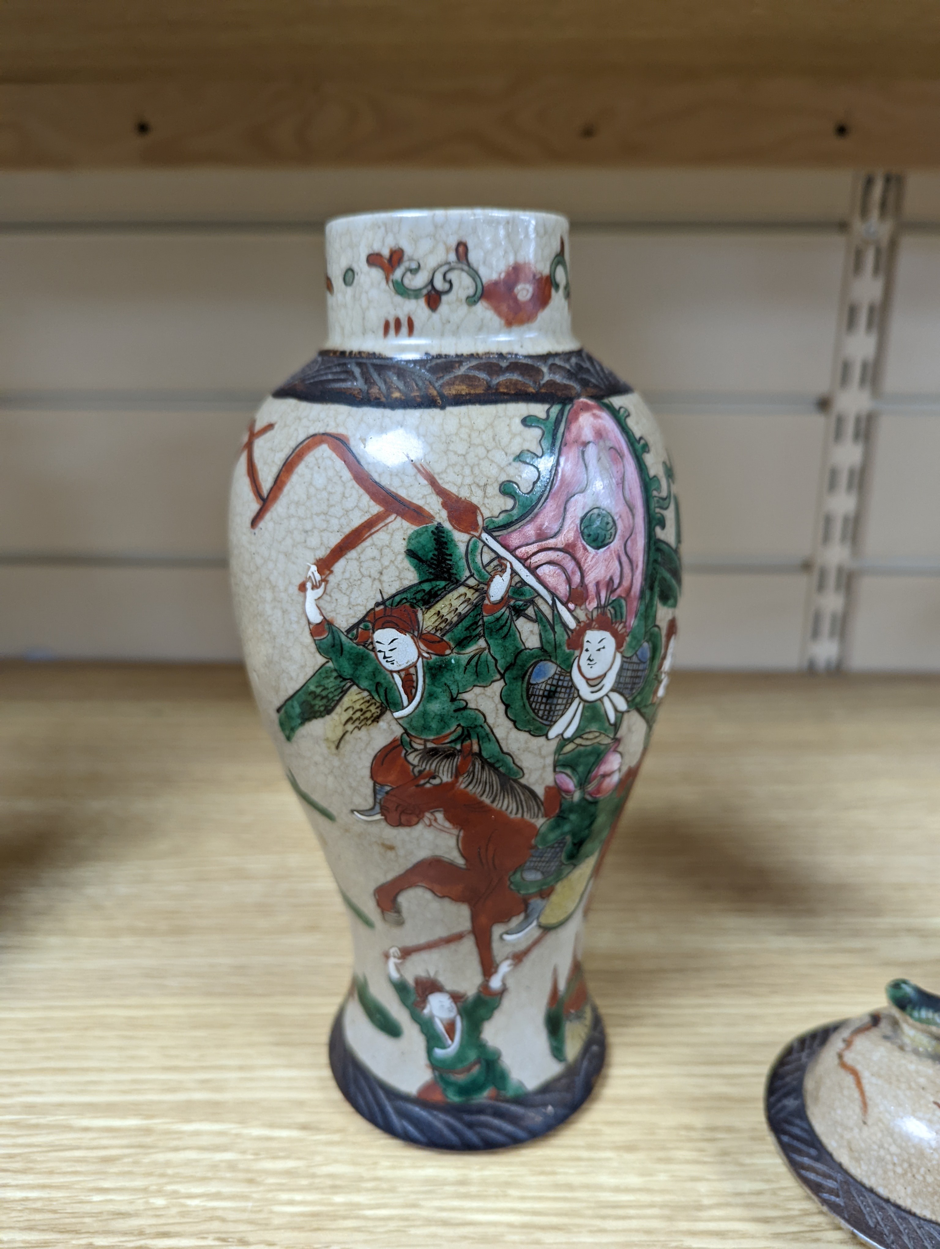 A late 19th century Chinese crackle glaze famille rose baluster vase and cover 30cm